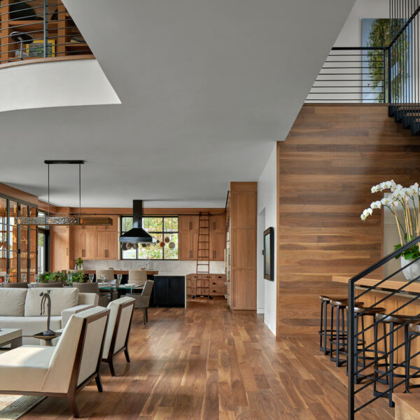 Overland Partners living room and kitchen with wooden floors. RED Winner
