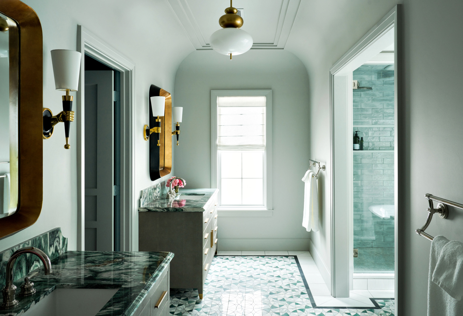Grey bathroom with mosiac tile floors and coffered ceiling. RED Winner.