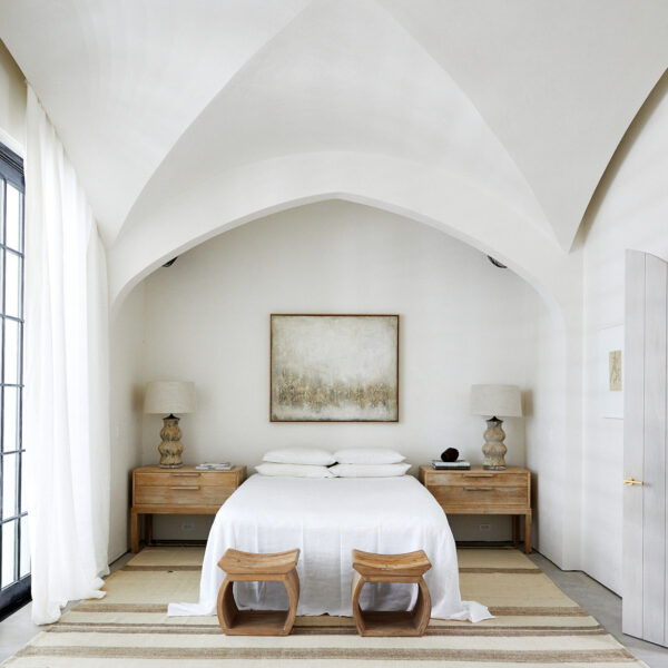 Crisp white bed in a white room with vaulted ceilings. RED Winner