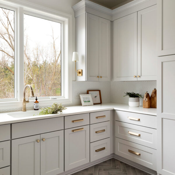 Martha O’Hara Interiors Combination mudroom, office laundry area, with white cabinetry Best of the Rest Jewel Box Spaces RED Winner