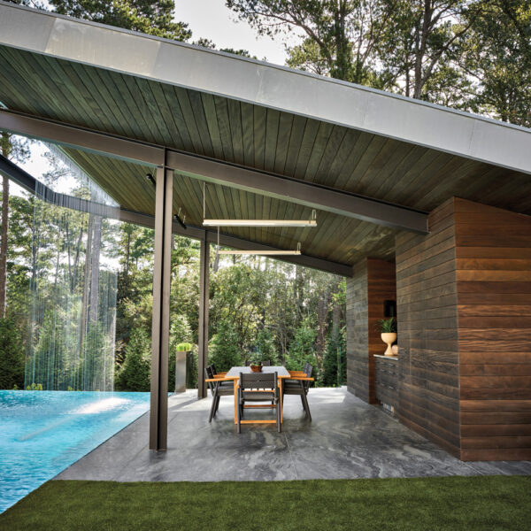 Harrison Design outdoor kitchen with pool and water feature