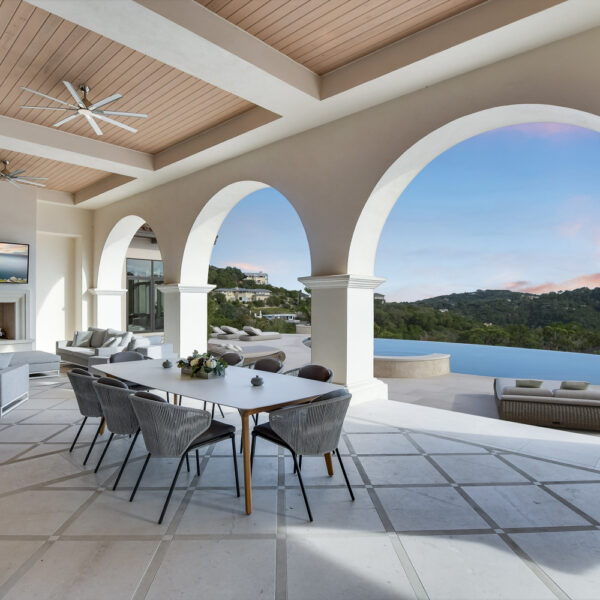 Jauregui Architect patio with arches and pool at sun set