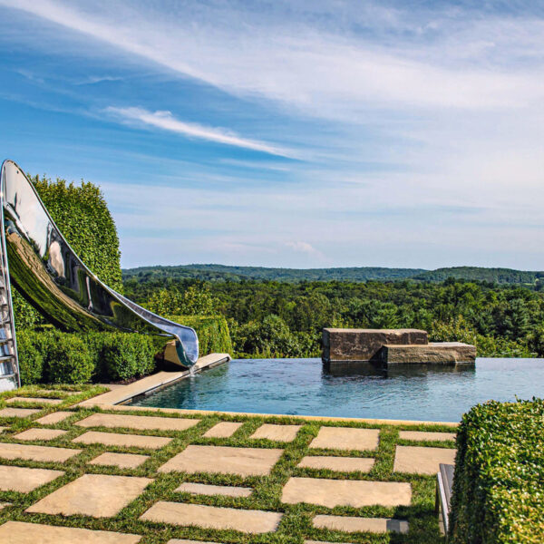 Glengate Company pool with slide surrounded by greenery