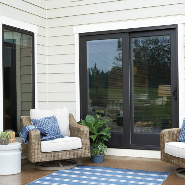 Black sliding patio doors on a crème colored house. RED winner.
