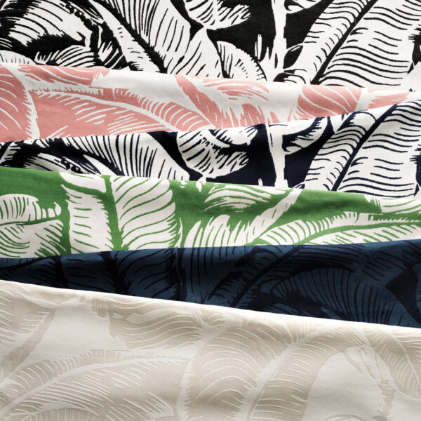 Close-up image of 6 palm-print fabric swatches in varying shades. RED Winner.