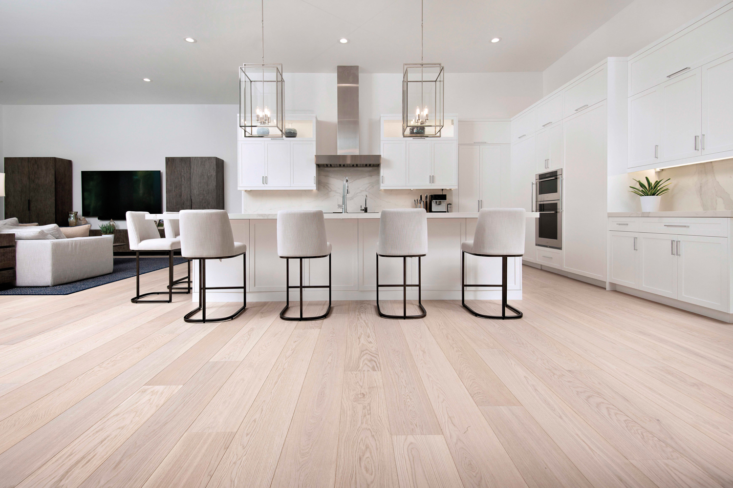 A white, modern kitchen with clean, light flooring. RED Winner.